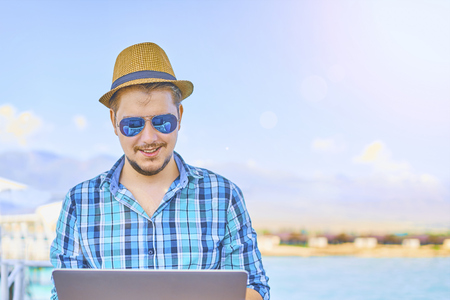 Businessman Holiday Working Business Travel Beach Concept.の写真素材