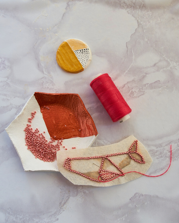 Creating a figurine of beads in the form of a sea whale in the workshopの写真素材