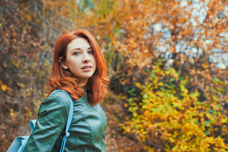 Young woman with autumn tree. Young woman with autumn background and fall yellow maple gar.の写真素材