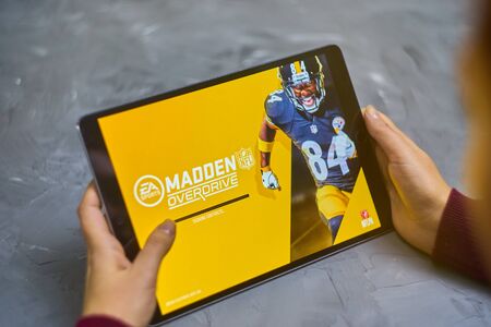 Bishkek, Kyrgyzstan - January 21, 2019: Girl playing a mobile game madden nfl of ea sports company on ipad proのeditorial素材