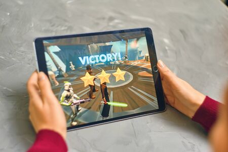 Bishkek, Kyrgyzstan - January 21, 2019: Woman plays a game in the star wars universe on Apple Ios tablet IPad Proのeditorial素材
