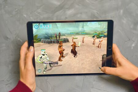 Bishkek, Kyrgyzstan - January 21, 2019: Woman plays a game in the star wars universe on Apple Ios tablet IPad Proのeditorial素材