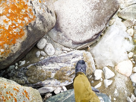 Feet trekking boots hiking Traveler alone outdoor wild nature Lifestyle Travel extreme survival conceptの写真素材