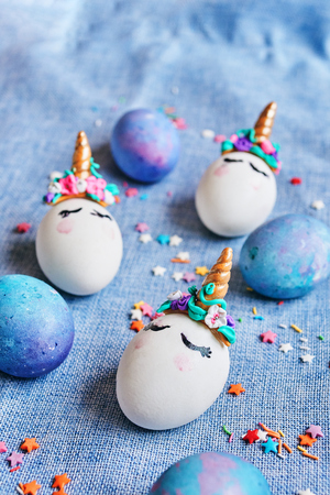 Easter eggs unicorns with painted closed eyesの写真素材