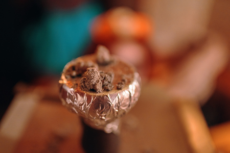 Coconut coals for a hookah pipe slowly wither away.の写真素材