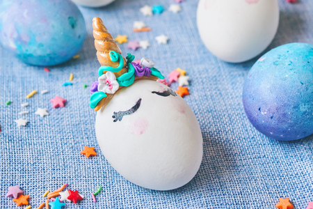 Easter eggs unicorns with painted closed eyesの写真素材