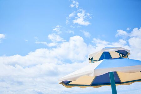 Beach umbrella on sunny day. Umbrella on perfect caribbean beach.の写真素材