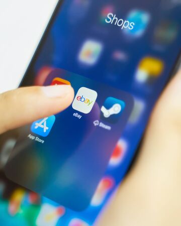 Bishkek, Kyrgyzstan - July 6 2019: EBay largest online auction and shopping websites application icon on Apple iPhone X screen close-upのeditorial素材