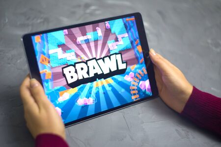 Bishkek, Kyrgyzstan - January 21, 2019: Playground battlefield gameplay. Woman play a free mobile game brawl stars developed by Supercell on ios ipad.のeditorial素材