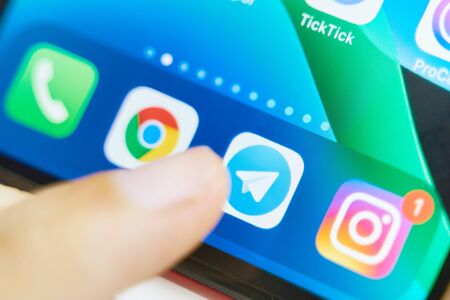 Bishkek, Kyrgyzstan - July 6 2019: Telegram application icon on Apple iPhone X screen close-up. Telegram app icon. Telegram is an online social media network. Social media appのeditorial素材