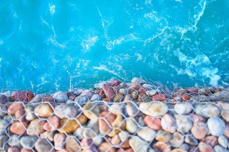 Sea Aerial view. Top of view limpid water on gravel beach .の写真素材