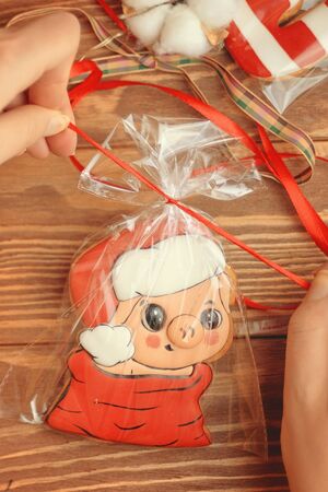 New Year gift. Packaging pig Santa Biscuits For Christmas.の写真素材