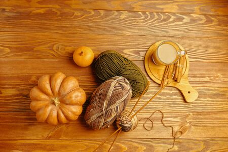 Pumpkin and coffee, knitting. Flay lay autumn pumpkins with knitting sweater and coffee.の写真素材