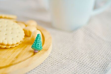 Decorative figure of a Christmas tree with cookies on the tableの写真素材