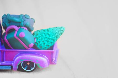 Miniature of a small Christmas car. Vintage purple Toy Cars On White Backgroundの写真素材