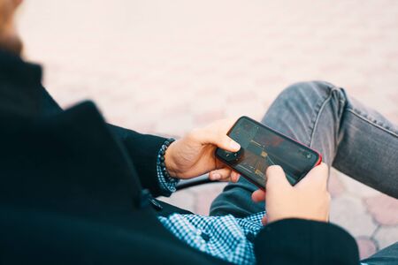 Bishkek, Kyrgyzstan - October 10, 2019: Man playing online game in call of duty mobile on iphone 11のeditorial素材