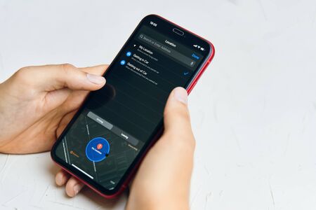 Bishkek, Kyrgyzstan - July 6 2019: New reminders application in ios 13. App with a location on iPhone X on the screen.のeditorial素材