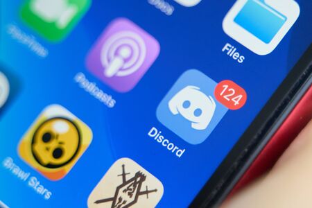 Bishkek, Kyrgyzstan - July 6 2019: Discord mobile app on the display of iPhone.のeditorial素材