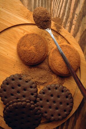 A pile of cookies and a spoonful of cocoa. Flatlay autumn conceptの写真素材