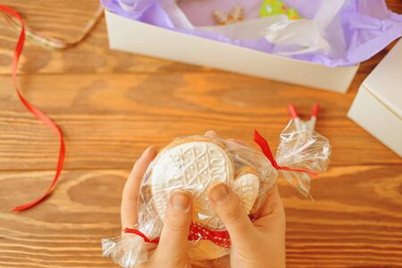 Christmas gift. White cookies in the shape of gloves.
