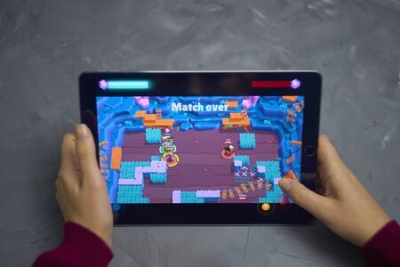 Bishkek, Kyrgyzstan - January 21, 2019: Playground battlefield gameplay. Girl play a free mobile game brawl stars developed and published by Supercell on ios laptop.のeditorial素材