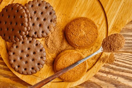 A pile of cookies and a spoonful of cocoa. Top viewの写真素材