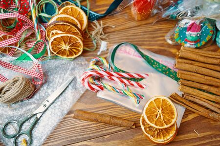 Christmas time. Process of packing gifts for holidaysの写真素材