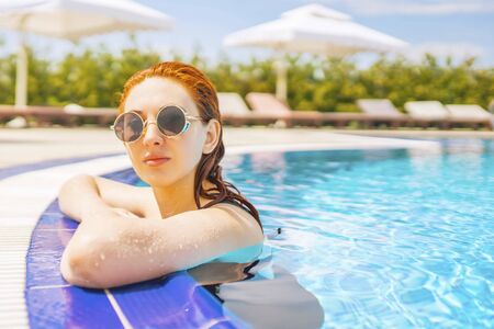 Woman swimming in the pool. Woman relaxing in swimming pool.の写真素材