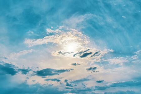 Sun in the sky. Sun in the sky. Sunny background, blue sky with white clouds and sun.の写真素材