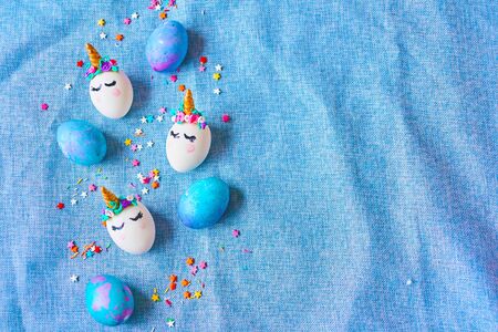 Easter eggs unicorns with painted closed eyesの写真素材