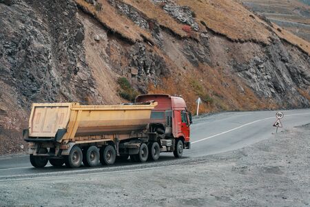 Car in the mountains. Cargo truck on the mountain highway.の写真素材