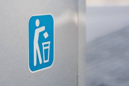 Trashcan logo on a modern garbage bin on the streetの写真素材