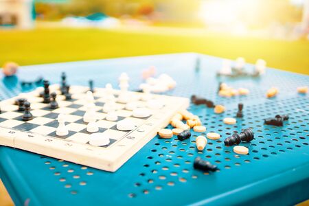 Chess on the table. Scattered chess summer day on the table in the hotel on the beach.の写真素材