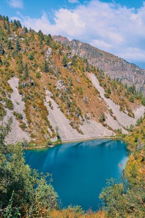 Lake in the mountains. Pond in the hills in Kyrgyzstan. Happy international mountain day.の写真素材
