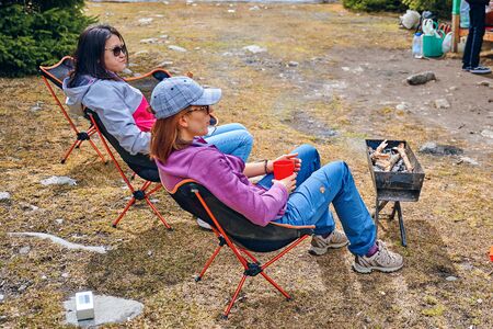 Bishkek, Kyrgyzstan - April 9, 2019: International mointain day. People rest after a hike.のeditorial素材