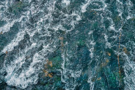 Mountain fast-flowing river with waves. Water Textureの写真素材