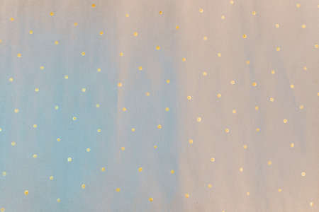 Gift wrapping paper texture. Painted paper, the concept of small golden blots, in the form of...