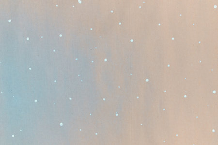 Texture of gift wrapping paper. Abstract drawing on craft paper for surprises. White dots in the form of snowflakes. The concept of Christmas and the New year.の写真素材