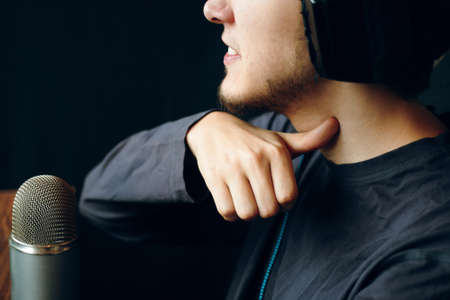 Mad gamer streamer man having violent look, making threatening sign, gesturing with index finger at...