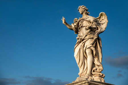 Beautiful detail of an Angel from the Bernini school, Castel Sant'Angelo, Vatican, from the Ponte degli Angeli over the Tiber, with a clear blue sky after a thunderstorm, Vatican, Rome, Italy.のeditorial素材