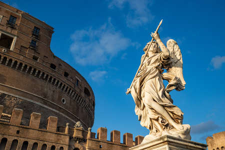 Angel with the spear of the Bernini school with the Castel Sant'Angelo, Vatican, from the Ponte degli Angeli over the Tiber, with a clear blue sky after a thunderstorm, Vatican, Rome, Italy.のeditorial素材