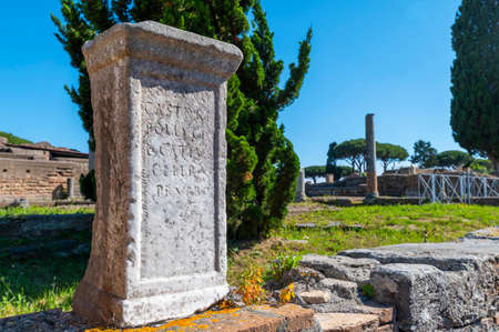 Rome Ostia Antica, beautiful detail of a Roman inscription in the Archaeological Park of Ostia in summer, Imperial period the port of Roma near the river of Tiber. Italy.のeditorial素材