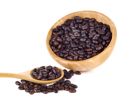 Coffee beans in wooden cup and spoon on white backgroundの写真素材