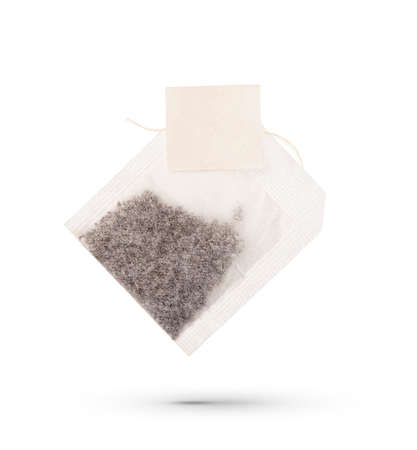 Tea bag with white label Isolated on white backgroundの写真素材