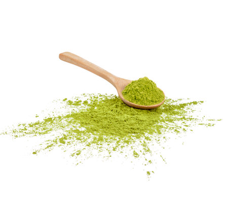 Green matcha powder in a spoonisolated on white backgroundの写真素材
