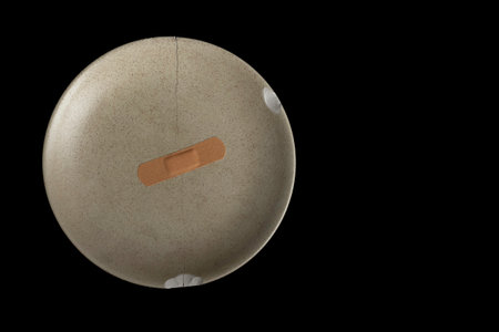 a broken dish on a black background