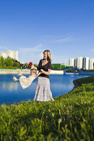 Mom and daughter at the lakeの写真素材