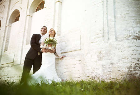 Happy bride and groom on their wedding dayの写真素材