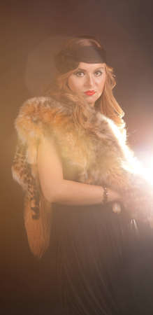portrait of a beautiful girl with fur and a black ribbon on his head