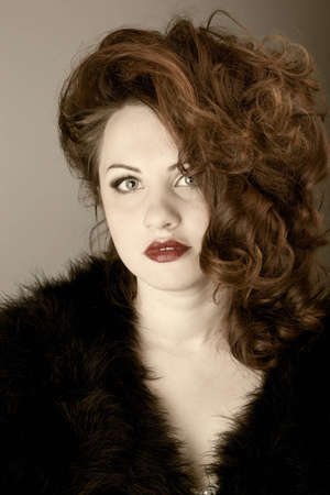 portrait of a beautiful red-haired woman with red lips